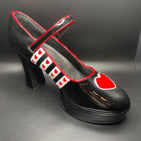 Black shoe with hearts.