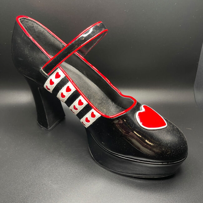 Black shoe with hearts.