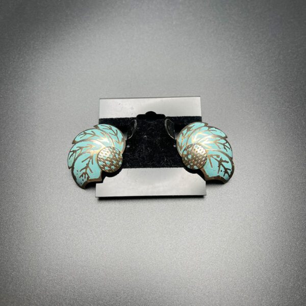 Feathered turquoise ear rings.