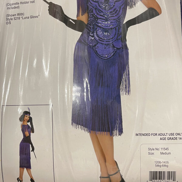 Adult lady dress in a twenties costume on the cover of a plastic package.