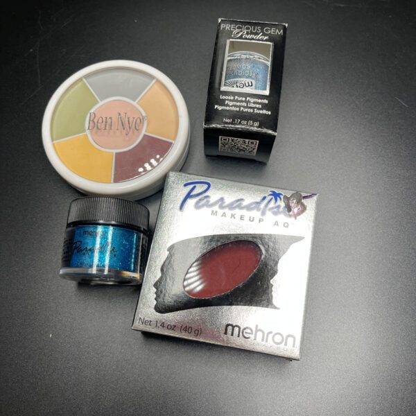 Assorted types of make up in different packaging.