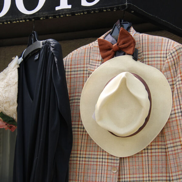 20s or vintage clothes hanging from Pok-a-dot's awning outside.