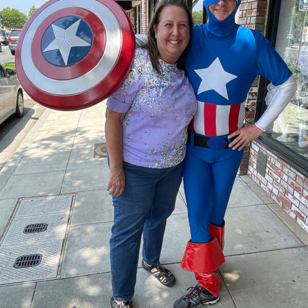 Cari Nuss with a man dressed as Captain America.