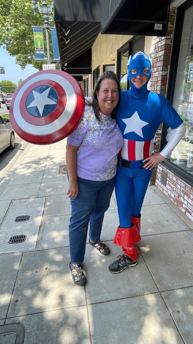 Cari Nuss with a man dressed as Captain America.