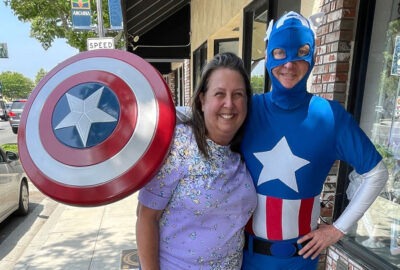 Cari Nuss with a man dressed as Captain America.