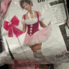 Adult lady maid costume on the cover of a plastic package.